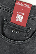 Dark grey denim jeans with HDS logo inner label near waistband