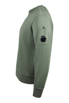 Olive green crewneck sweatshirt, side lens pocket detail on sleeve
