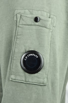 Olive green brushed fleece sleeve patch with C.P. Company lens button