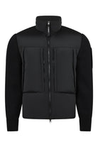 Black padded jacket with rib-knit sleeves, hood, and full-length zip front