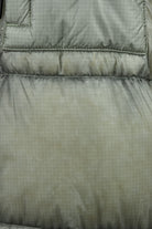 Quilted puffer jacket back panel with horizontal baffle stitching