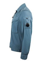 Blue overshirt side view with sleeve button and chest pocket