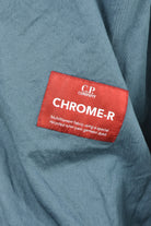 Blue overshirt with red Chrome-R fabric label patch