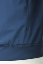 Blue tech stretch jacket hem with stitched seam and elastic waistband
