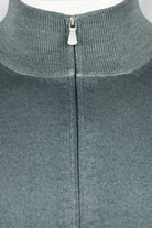 Petrol blue ribbed stand collar with metal zip pull on full-zip cardigan.