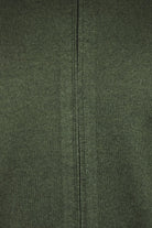 Close-up of bottle green full-zip cardigan zipper seam and knit texture