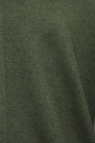 Bottle green knit cardigan fabric close-up with subtle speckled texture