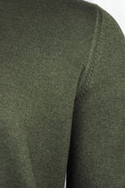 Bottle green cardigan sleeve and shoulder knit close-up