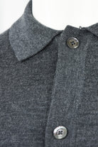Close-up of the cardigan's pointed collar and top buttons