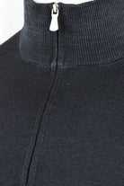 Close-up of the Zattura jumper's zipper pull and ribbed collar