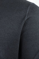 Close-up of the Zattura jumper's shoulder seam and fine knit texture
