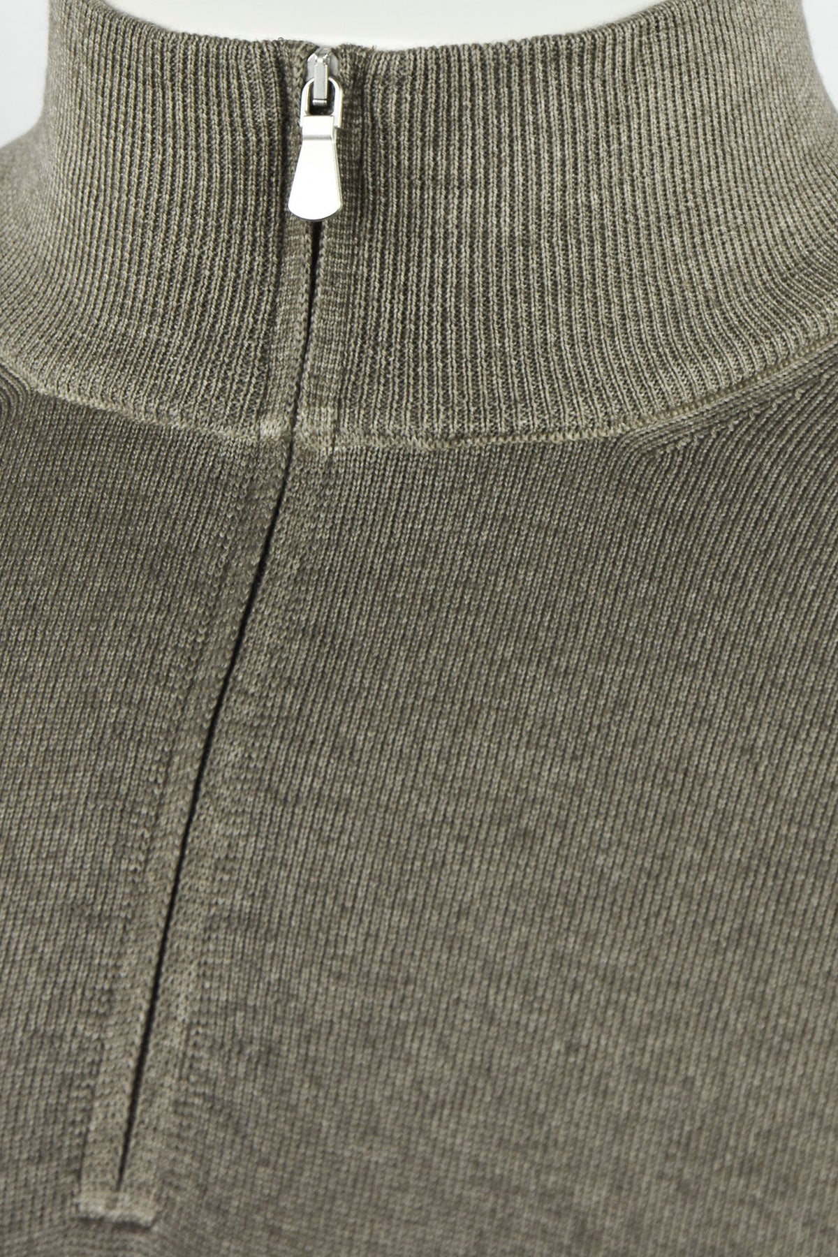 Close-up of the jumper's ribbed collar and metal zipper pull