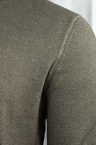 Close-up of the jumper's shoulder seam and knit texture