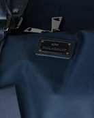 Blue holdall with Paul & Shark metal logo patch on strap