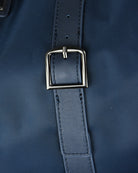 Blue leather strap section with square buckle on nylon holdall