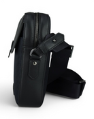 Blue crossbody bag side view with zip pocket, adjustable web strap, metal grommets.