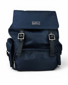 Nylon backpack with flap cover, leather trim details, and front pockets; blue.