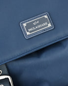 Paul & Shark logo plaque on blue nylon backpack flap with stitched leather-style trim.
