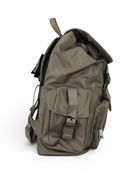 Beige nylon backpack with top carry handle, rear mesh panel, flap pockets and straps.