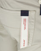 Light grey shorts fabric label showing super stretch and relax
