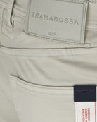 Light grey shorts with TRAMAROSSA 1967 label and fabric composition tag