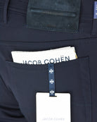 Navy five-pocket waistband detail with Jacob Cohen label and contrast stitching.