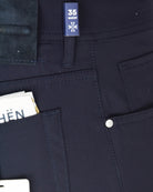 Navy pants interior view with 35 waist tag and front pocket seams.