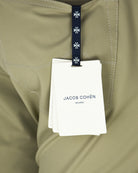 Beige pant front with hangtag, drawstring waist and visible contrast stitching