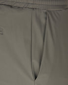 Tech stretch sport pant waistband close-up with elastic casing and seam