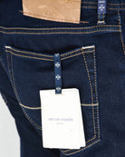 Dark wash denim pocket with contrast stitching and JACOB COHEN leather badge tag
