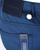 Blue woven pants waist with metal button and care tags