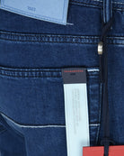 Denim jeans waistband label with Tramarossa branding and care text