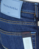 Tramarossa label on dark blue denim pocket, with yellow contrast stitching