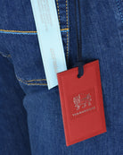 Dark blue denim jeans with red Tramarossa hang tag and light care label