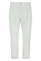 Off-white nylon jersey pants with elastic waistband and drawstring, straight cropped legs