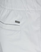 Off-white pants close-up: side pocket with welt seam and Herno label