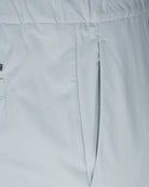 Off-grey nylon jersey pant front seam and center panel with clean stitching