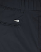 Herno black nylon pants close-up of logo patch and side seam
