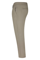 Taupe tech pants, back view, tapered leg, minimal back pockets.