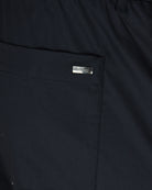 Herno branded tag on dark navy stretch cotton pants pocket