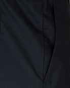 Dark navy stretch cotton pants fabric close-up with seam detailing