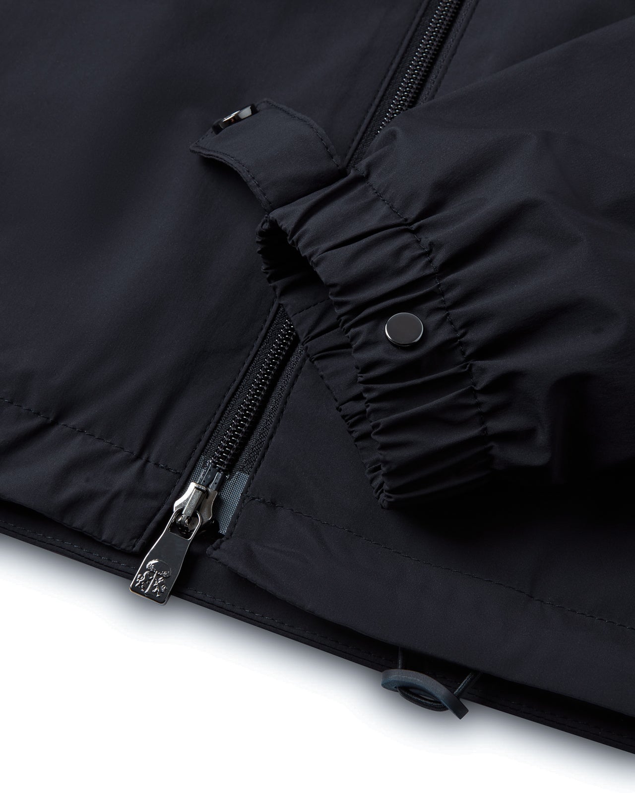 Navy jacket sleeve with zip front and snap-button storm flap