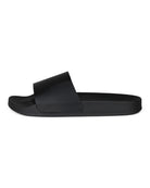 Black leather wave-print slide sandal with textured strap over dark sole