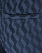 Blue jacquard terry shorts close-up of front button and waistband