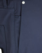 Navy technical pants waistband with button closure and drawstring channel