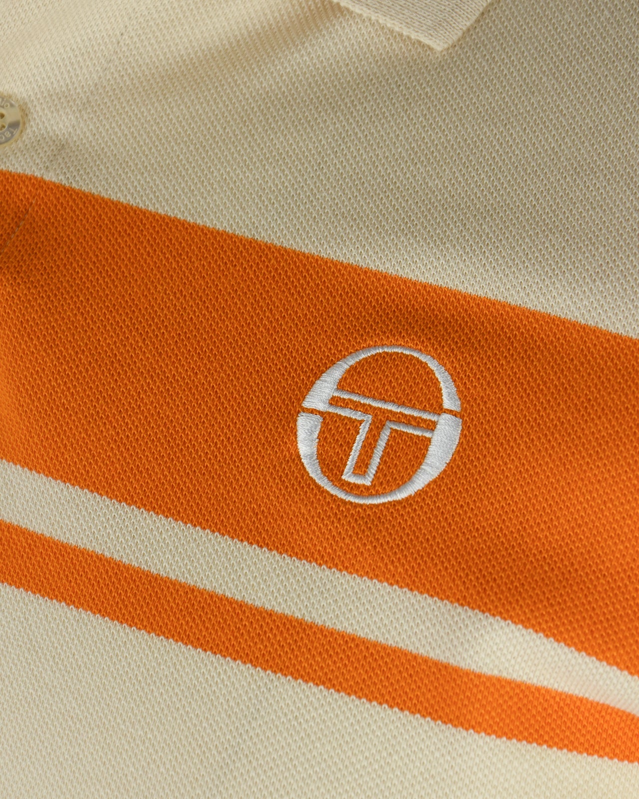 Sergio Tacchini logo badge on orange-and-sand striped polo fabric