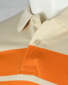 Kids polo shirt collar and button placket in sand with orange stripe