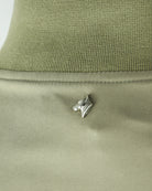 Rib-knit collar on a smoke green blouson jacket with small logo pin