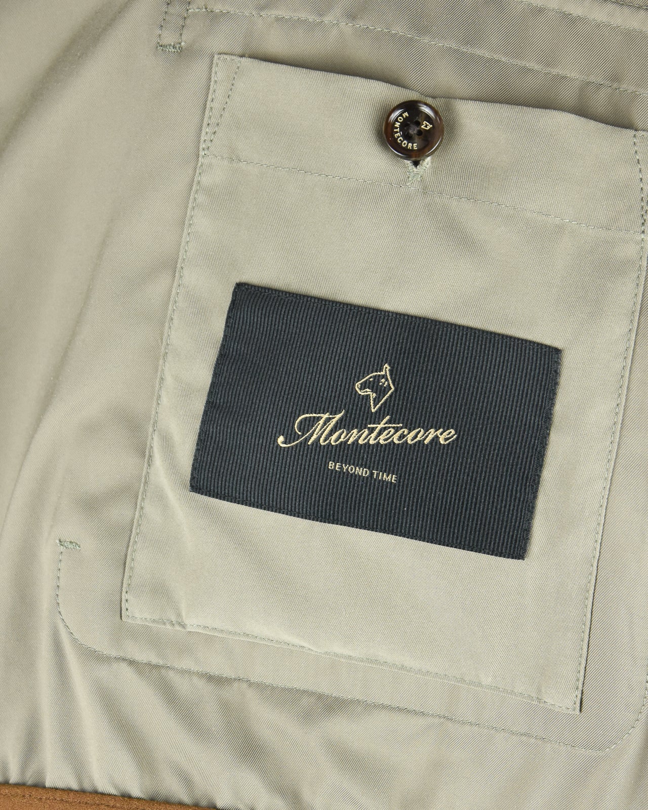 Smoke green blouson jacket interior pocket label with Montecore logo