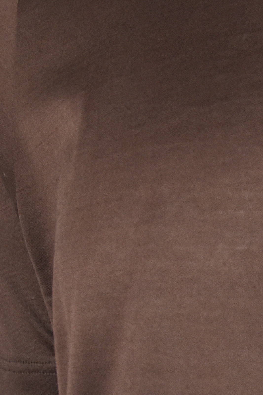 Mercerised knit fabric closeup on dark brown t-shirt